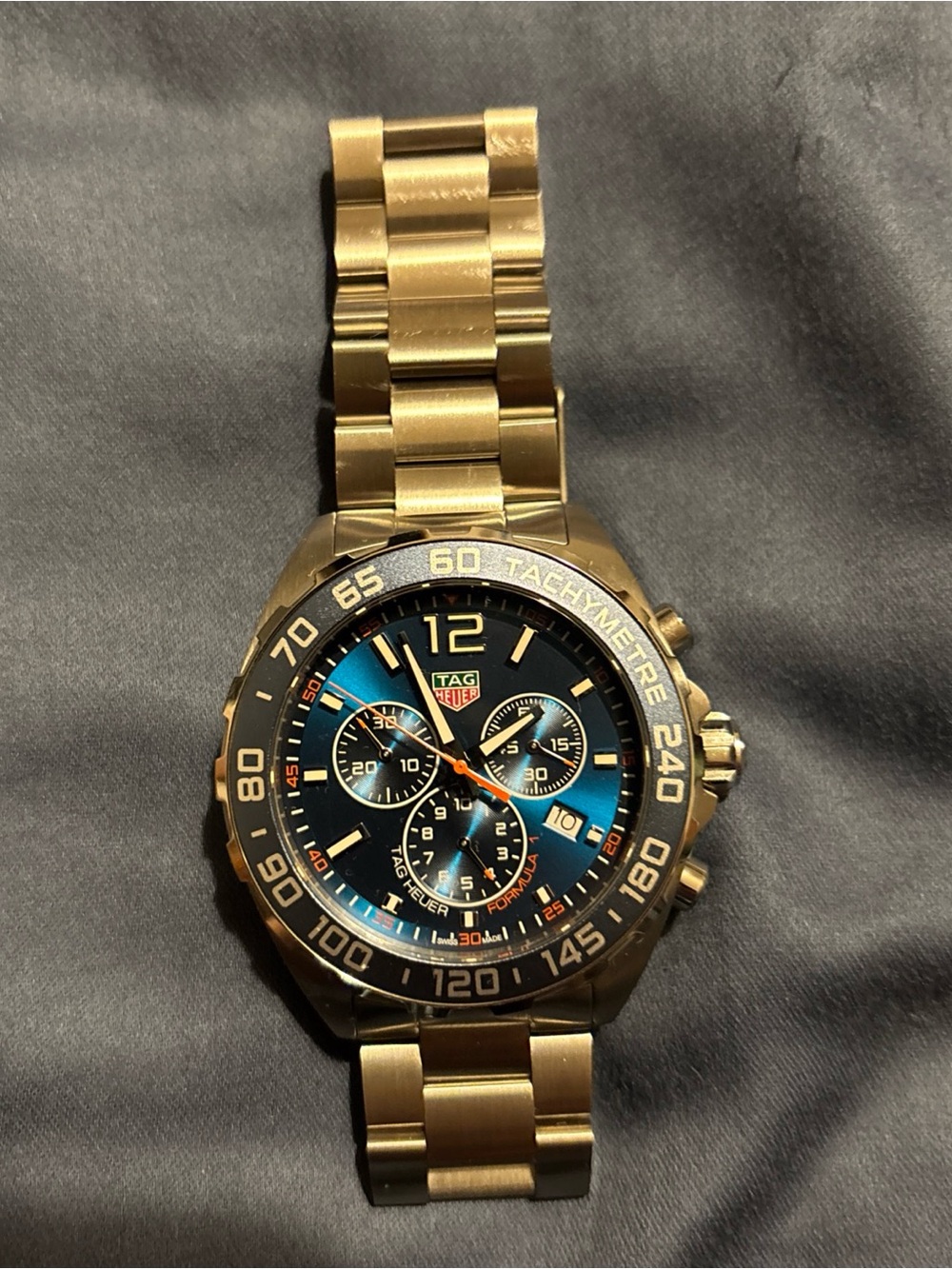 Tag Heuer silver Watch with Blue and orange dial chronograph formula 1